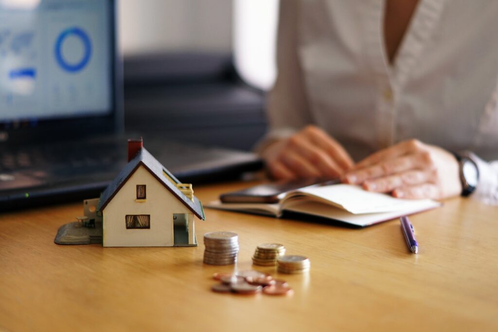 Closeup shot of a person thinking of buying or selling a house.
