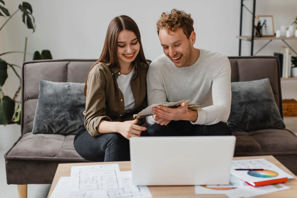 Happy Couple making plans to remodel their home even with bad credit